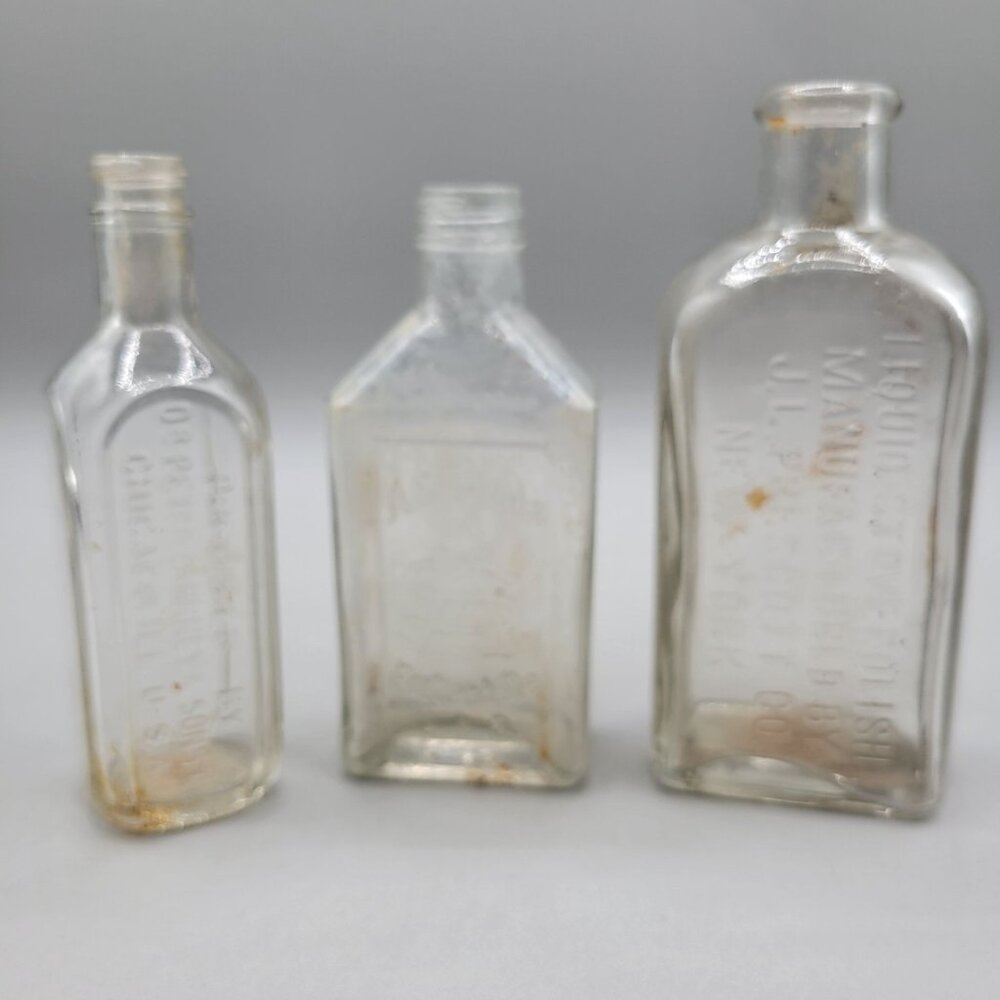 Antique Glass Bottles Clear Embossed Set of 3